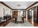 Charming dining room with decorative ceiling, and dark-stained wood trim at 4455 Broadway St, Indianapolis, IN 46205