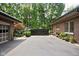 Driveway leading to the house, showcasing the garage, backyard and lush landscaping at 4455 Broadway St, Indianapolis, IN 46205