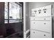 Charming entryway featuring a decorative door, shoe storage, and key hooks at 4455 Broadway St, Indianapolis, IN 46205