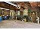 Interior of a garage with storage solutions, tools, and a classic brick wall design at 4455 Broadway St, Indianapolis, IN 46205