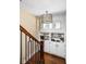 Hallway with custom shelving and drawers, and a decorative chandelier at 4455 Broadway St, Indianapolis, IN 46205