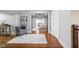 Comfortable hallway with hardwood floors, decorative rug and sitting area leading into the Primary bedroom at 4455 Broadway St, Indianapolis, IN 46205