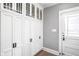 Hallway featuring custom built-in storage cabinets with sleek hardware at 4455 Broadway St, Indianapolis, IN 46205