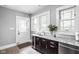 Kitchenette area features granite countertops, wine cooler, and stainless steel appliances at 4455 Broadway St, Indianapolis, IN 46205