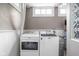 Functional laundry room equipped with a modern Maytag washer and dryer set at 4455 Broadway St, Indianapolis, IN 46205