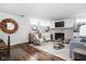 Cozy living room with a fireplace, exposed ductwork, and comfortable seating, ideal for relaxing and entertaining at 4455 Broadway St, Indianapolis, IN 46205