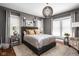 Cozy main bedroom featuring a stylish rug, and modern lighting fixtures at 4455 Broadway St, Indianapolis, IN 46205
