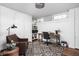 Functional home office space with custom shelving and a comfortable chair at 4455 Broadway St, Indianapolis, IN 46205