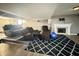 Spacious finished basement features a cozy seating area with a fireplace and a blue exercise ball at 4655 Rockcress Ct, Zionsville, IN 46077