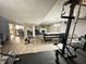 Spacious basement featuring an exercise area, Gathering room with fireplace and game table at 4655 Rockcress Ct, Zionsville, IN 46077