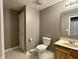 Neutral bathroom featuring vanity, commode and a shower/tub enclosure at 4655 Rockcress Ct, Zionsville, IN 46077