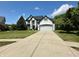 Charming two-story traditional home with a manicured lawn and a long driveway at 4655 Rockcress Ct, Zionsville, IN 46077