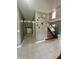 Bright entryway with staircase, tile floors, and a unique decorative clock at 4655 Rockcress Ct, Zionsville, IN 46077