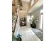 Inviting foyer with tile flooring, high ceilings, a staircase adorned with greenery, and a neutral color scheme at 4655 Rockcress Ct, Zionsville, IN 46077