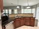This kitchen features granite counters, stainless appliances, and tile backsplash at 4655 Rockcress Ct, Zionsville, IN 46077
