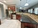 This kitchen features granite counters, stainless appliances, and tile backsplash at 4655 Rockcress Ct, Zionsville, IN 46077