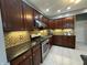This kitchen features granite counters, stainless appliances, and tile backsplash at 4655 Rockcress Ct, Zionsville, IN 46077