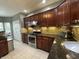 This kitchen features granite counters, stainless appliances, and tile backsplash at 4655 Rockcress Ct, Zionsville, IN 46077