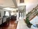 Open-concept living room with hardwood floors and direct access to the staircase at 4655 Rockcress Ct, Zionsville, IN 46077