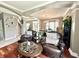 Inviting living room with hardwood floors, open layout, and staircase access at 4655 Rockcress Ct, Zionsville, IN 46077