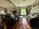 Comfortable living room featuring hardwood floors and a view into the dining area at 4655 Rockcress Ct, Zionsville, IN 46077