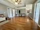 An open living room featuring hardwood floors, overhead lighting, and comfortable seating at 4655 Rockcress Ct, Zionsville, IN 46077