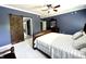 Spacious blue Primary bedroom features barn door to ensuite bath at 4655 Rockcress Ct, Zionsville, IN 46077