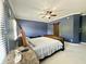 Bedroom featuring a bed, a window, and an exposed barn-style door at 4655 Rockcress Ct, Zionsville, IN 46077