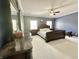 A large bedroom with blue walls, a bed, and a dresser at 4655 Rockcress Ct, Zionsville, IN 46077