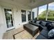 Inviting screened porch featuring a comfortable seating arrangement, ideal for relaxing and enjoying the outdoor ambiance at 4655 Rockcress Ct, Zionsville, IN 46077