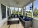 Cozy screened porch with stylish furniture, offering a perfect blend of indoor comfort and outdoor serenity for relaxation at 4655 Rockcress Ct, Zionsville, IN 46077