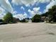 Residential street featuring well-manicured lawns and attractive homes under a blue sky with fluffy clouds at 4655 Rockcress Ct, Zionsville, IN 46077