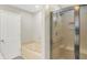 This bathroom features a tub with tile and a shower with a glass door at 5015 Nowland Ave, Indianapolis, IN 46201