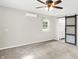 Spacious bedroom with carpet and barn door to bathroom at 5015 Nowland Ave, Indianapolis, IN 46201