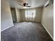 Bedroom featuring carpeting, ceiling fan, and natural light at 5015 Nowland Ave, Indianapolis, IN 46201