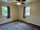 Bedroom with neutral paint, carpet, ceiling fan, and windows at 5015 Nowland Ave, Indianapolis, IN 46201