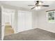 This bedroom features carpeted floors and a window with blinds at 5015 Nowland Ave, Indianapolis, IN 46201