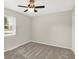 This bedroom features carpeted floors and a window with blinds at 5015 Nowland Ave, Indianapolis, IN 46201