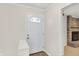 Bright entryway with a white front door, showcasing a glimpse into the living area at 5015 Nowland Ave, Indianapolis, IN 46201