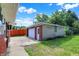 Backyard view of the brick detached garage with side door at 5015 Nowland Ave, Indianapolis, IN 46201