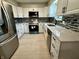 Updated kitchen featuring white cabinets, stainless appliances, and modern countertops at 5015 Nowland Ave, Indianapolis, IN 46201