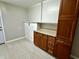 Laundry room has laminate floors, storage, washer and dryer hookups, and access to outside at 5015 Nowland Ave, Indianapolis, IN 46201