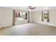 Inviting living room with hardwood floors, neutral walls, and large windows for ample natural light at 5015 Nowland Ave, Indianapolis, IN 46201