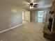 Open living room with wood flooring, neutral paint, and access to the sunroom at 5015 Nowland Ave, Indianapolis, IN 46201