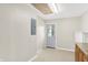 Mud room with gray door, light-colored walls and wood-look floors at 5015 Nowland Ave, Indianapolis, IN 46201
