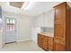 Mud room with storage cabinets, light-colored walls and wood-look floors at 5015 Nowland Ave, Indianapolis, IN 46201