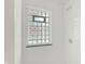 White tile shower with glass block window and shower head at 5015 Nowland Ave, Indianapolis, IN 46201