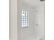 White tiled shower with glass block window at 5015 Nowland Ave, Indianapolis, IN 46201