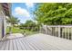 Relax on this large, gray back deck, overlooking a fenced backyard perfect for outdoor enjoyment and entertaining at 5305 Traditions Rd, Indianapolis, IN 46235