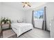 Comfortable bedroom filled with natural light from a window and stylish decor at 5305 Traditions Rd, Indianapolis, IN 46235